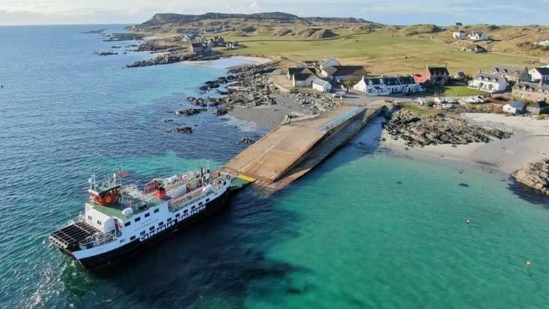 Aerial view of the ferry slipway and Caledonian MacBrayne vessel on Iona