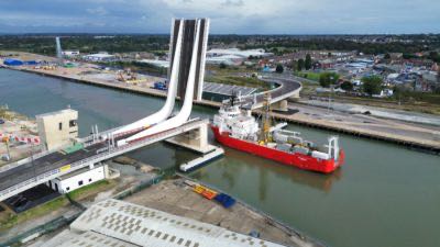 Gullwing Bridge open to shipping with a vessel passing through