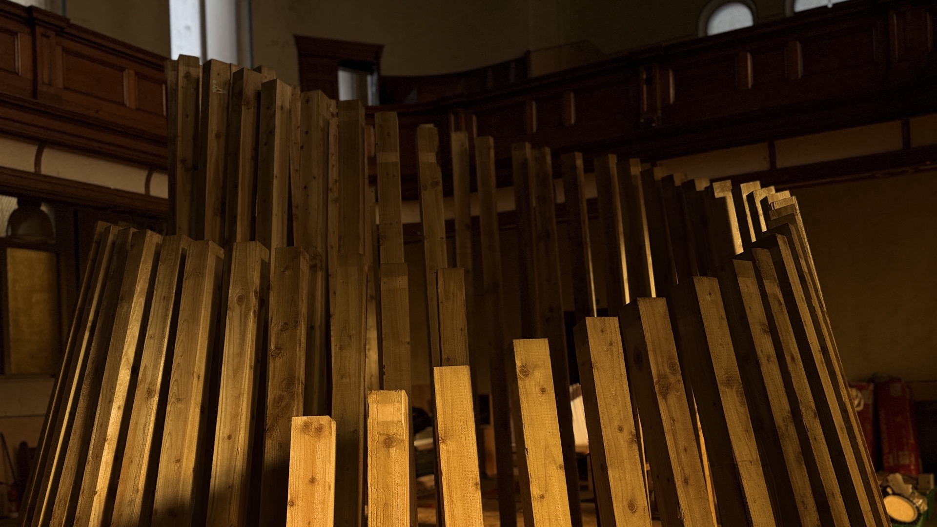 Timber posts staged inside a heritage hall